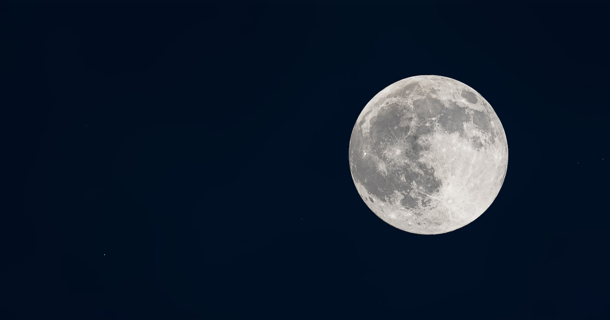 A plain, clear full moon in the night sky